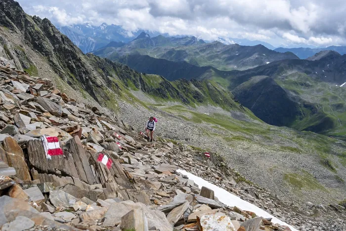 Framed Print : Red and white trail markings, hiker in the high mountains