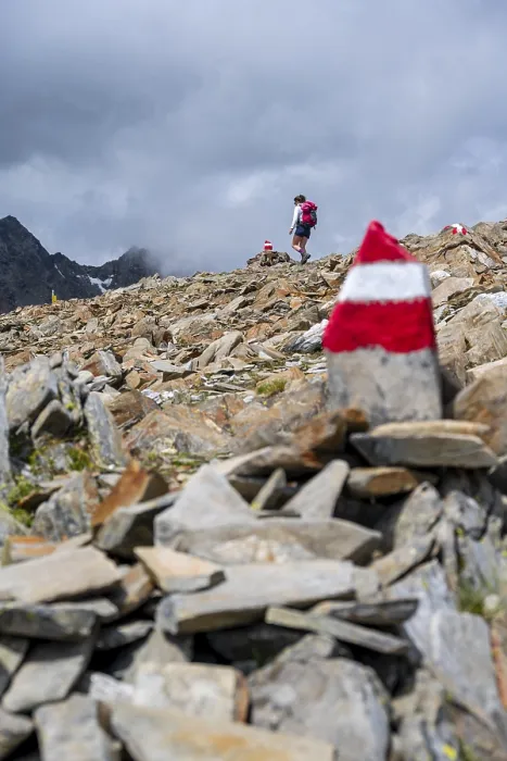 Framed Print : Red and white trail markings, hiker in the high mountains