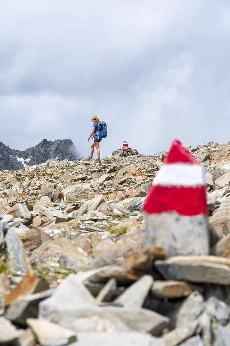 Framed Print : Red and white trail markings, hiker in the high mountains