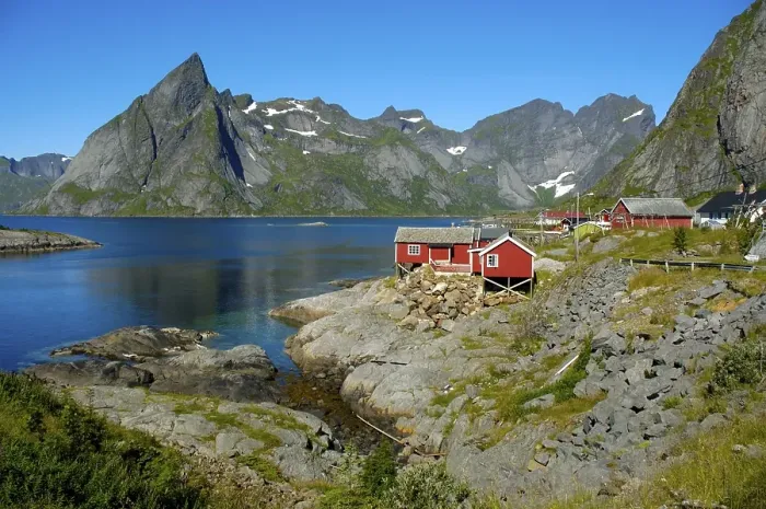 Framed Print : Red wooden house mountains and fjord Hamnoya Moskenesoya Lofoten Norway