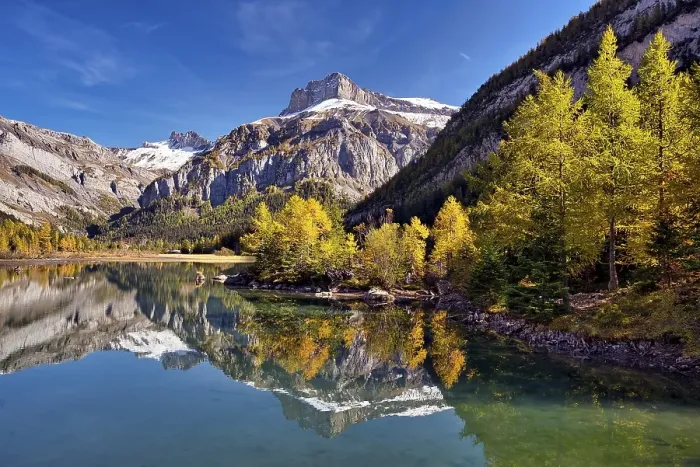 Framed Print : Reflection of the mountains and autumnal larches in Lac de Derborence, Canton Valais, Switzerland, Europe