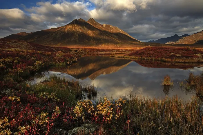 Framed Print : Reflection of mountains in a small lake in morning light