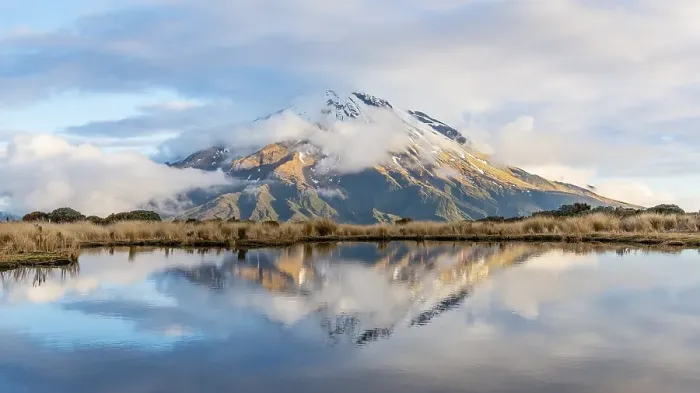 Framed Print : Reflection in Pouakai Tarn, stratovolcano Mount Taranaki or Mount Egmont with cloud Framed Print : Reflection in Pouakai Tarn, stratovolcano Mount Taranaki or Mount Egmont with cloud