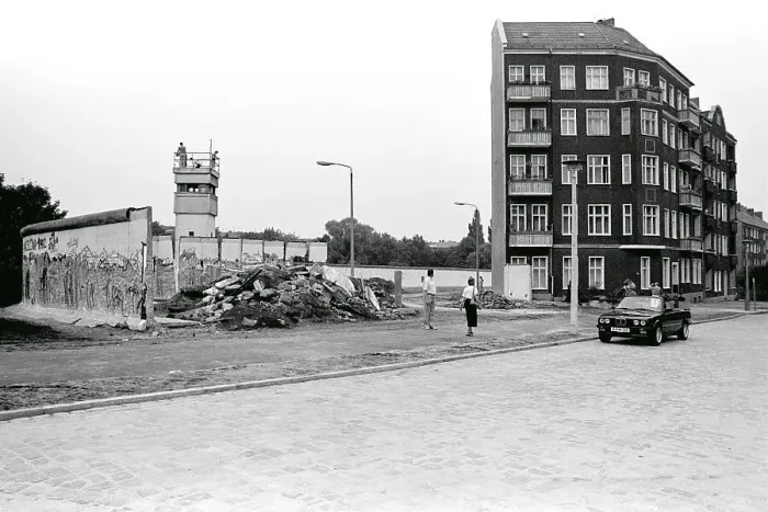 Framed Print : Remains of the Berlin Wall with a watchtower at Lohmuehlenstrasse road Framed Print : Remains of the Berlin Wall with a watchtower at Lohmuehlenstrasse road