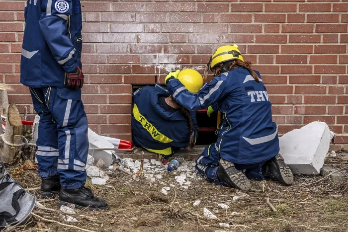 Framed Print : Rescue and recovery of people after a drone attack on a residential building in a civil defence scenario