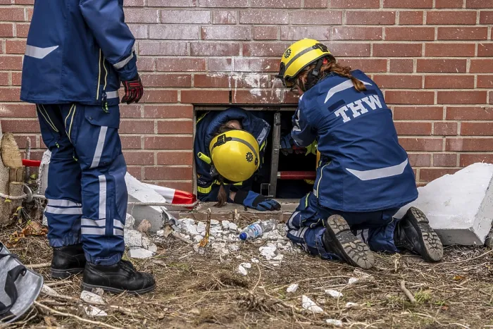 Framed Print : Rescue and recovery of people after a drone attack on a residential building in a civil defence scenario