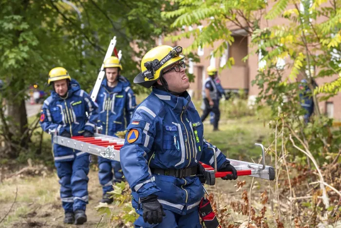 Framed Print : Rescue and recovery of people after a drone attack on residential buildings in a civil defence scenario