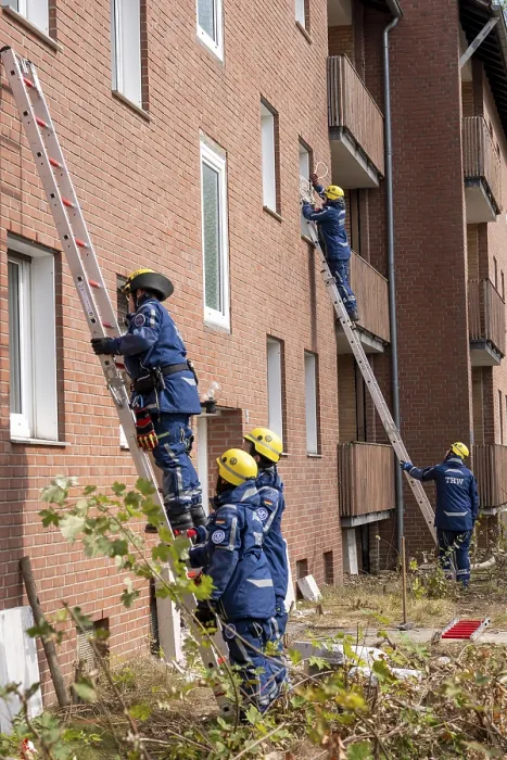 Framed Print : Rescue and recovery of people after a drone attack on residential buildings in a civil defence scenario