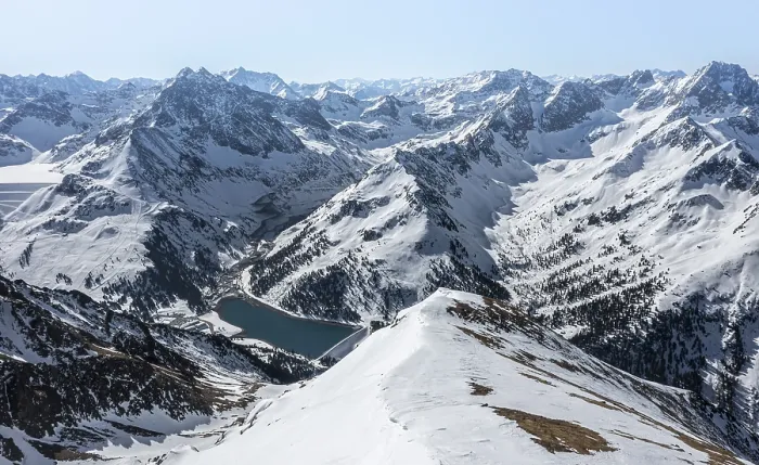 Framed Print : Reservoir, peaks and mountains in winter
