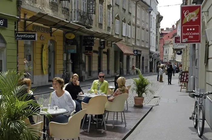 Framed Print : Restaurant guests in the old part of the town Framed Print : Restaurant guests in the old part of the town