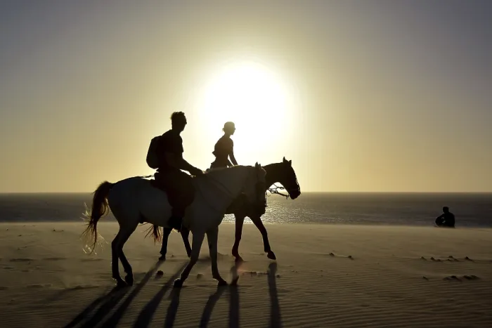Framed Print : Two riders on horseback on the beach Framed Print : Two riders on horseback on the beach