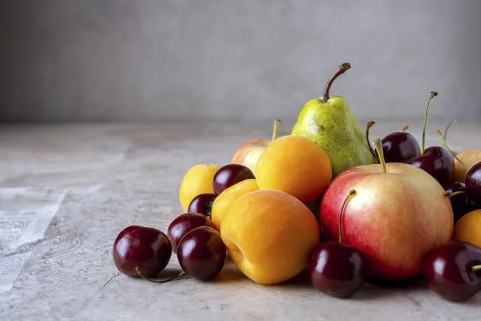 Framed Print : Ripe fruits on a beige background