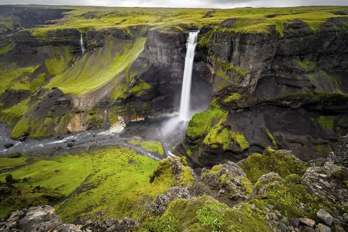 Framed Print : River and waterfalls at a canyon with green moss