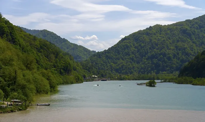 Framed Print : Rivers of different colors surrounded by forested mountains and blue sky