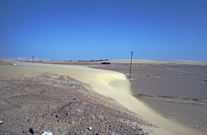 Framed Print : Road blocked by sickle dune, Rotel-Tours bus drives bypass road