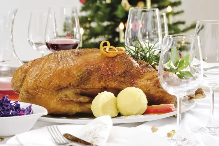 Framed Print : Roast goose, red cabbage, dumplings on a festively decorated table