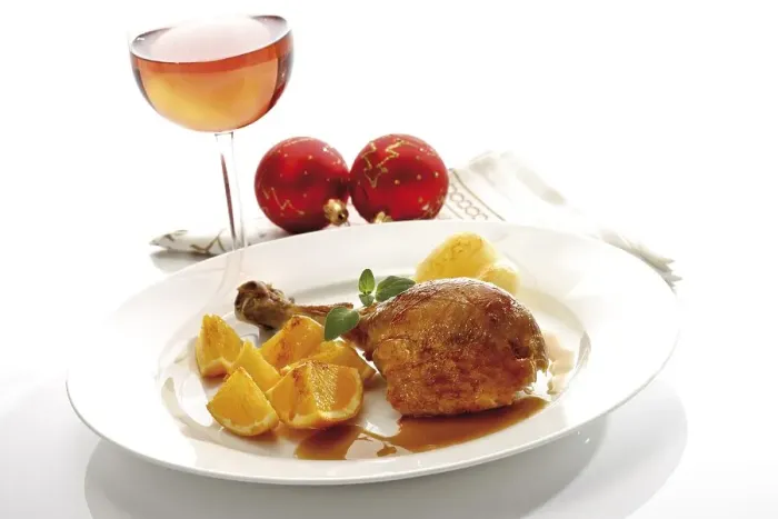 Framed Print : Roast turkey drumstick served on a white plate with orange slices