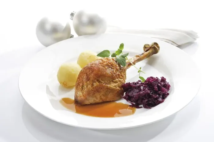 Framed Print : Roast turkey drumstick served on a white plate with red cabbage Framed Print : Roast turkey drumstick served on a white plate with red cabbage