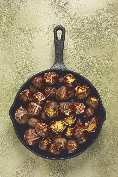Framed Print : Roasted chestnuts, in an iron pan