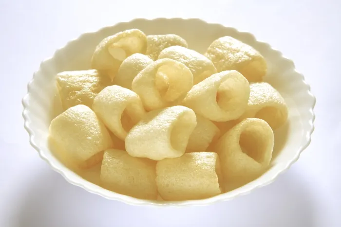 Framed Print : Roasted round chips in bowl on white background