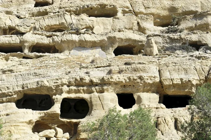 Framed Print : Rock caves, living caves, Matala beach