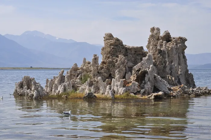 Framed Print : Rocks, limestone formations, in a calm lake