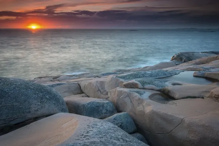 Framed Print : Rocks, sunset, evening atmosphere at the coastline near Smoegen