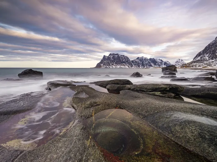 Framed Print : Rocks at Utakleiv beach with rock formation Eye of Utakleiv Framed Print : Rocks at Utakleiv beach with rock formation Eye of Utakleiv