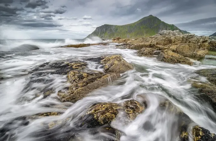 Framed Print : Rocks and wild sea surf, on the beach at Flakstad