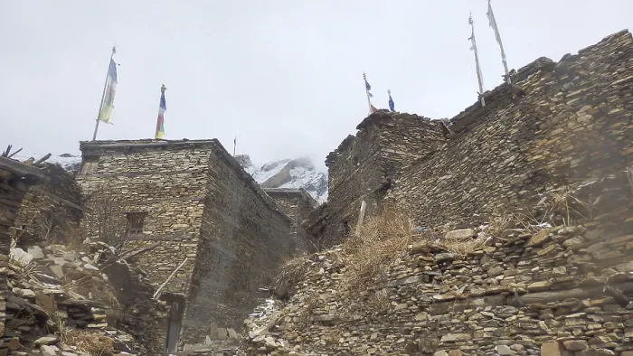 Framed Print : Rocky alleys and buildings in a mountain village with prayer flags