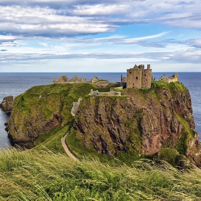Framed Print : Rocky headland with castle ruins