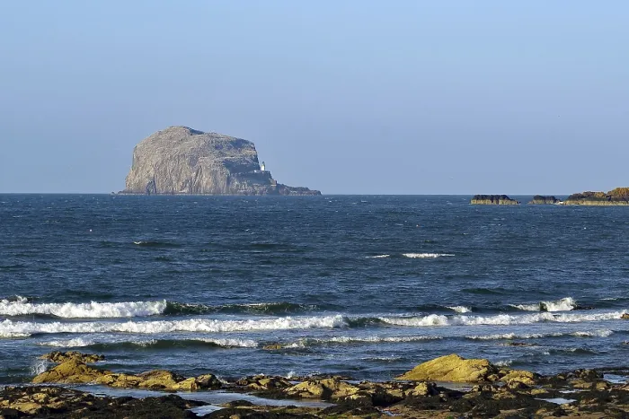 Framed Print : Rocky island rises from the sea Framed Print : Rocky island rises from the sea
