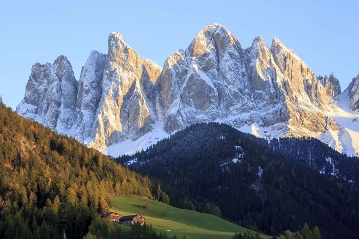 Framed Print : Rocky mountain peaks in the warm light of the setting sun