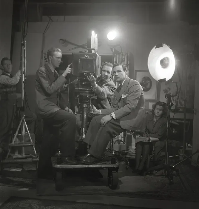 Framed Print : Rolf Husberg. 1908-1998. Swedish film director. Here during the shooting of the film Three Sons Went to the Air: A film about the Hallman family and their three sons at the airfield in 1944. Behind the film camera is Olle Nordemar, 1914-1999 Framed Print : Rolf Husberg. 1908-1998. Swedish film director. Here during the shooting of the film Three Sons Went to the Air: A film about the Hallman family and their three sons at the airfield in 1944. Behind the film camera is Olle Nordemar, 1914-1999