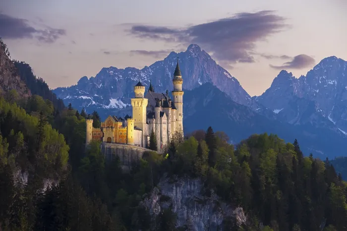 Framed Print : Romantic castle embedded in a mountain landscape in the evening