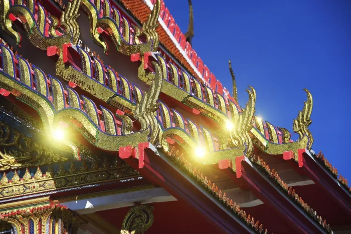 Framed Print : Roof ornaments and pagodas with reflections of the sun