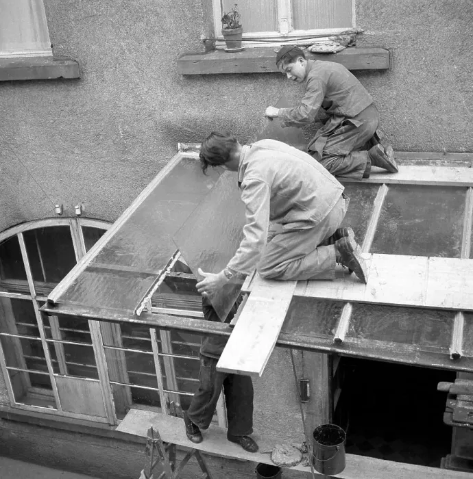 Framed Print : Three roofers repair a canopy with glass panels