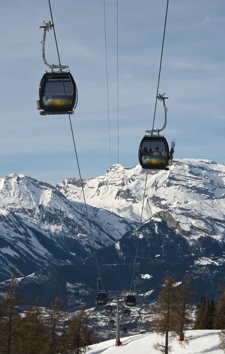 Framed Print : Rope-way against a background of snow-capped peaks
