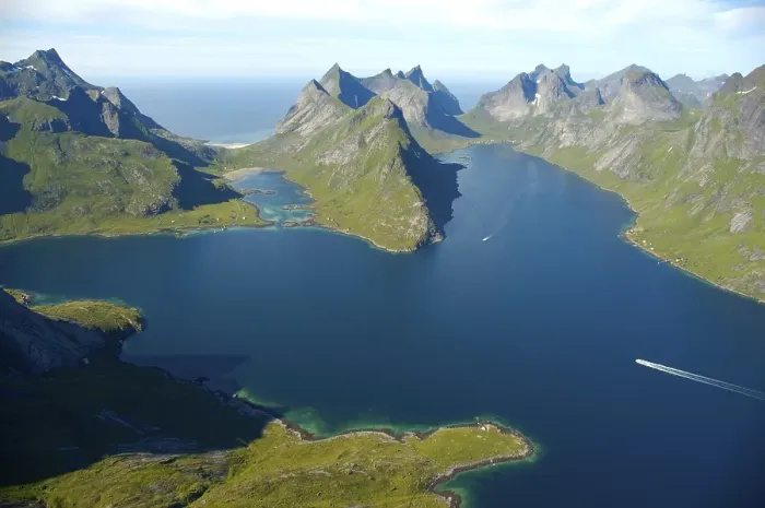 Framed Print : Rough mountains with fjord Kjerkfjorden and boat Moskenesoya Lofoten Norway