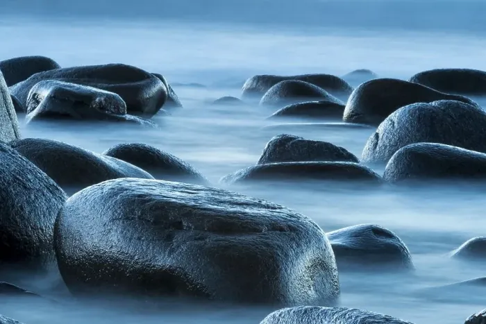 Framed Print : Round stones in the surf, beach of Utakleiv