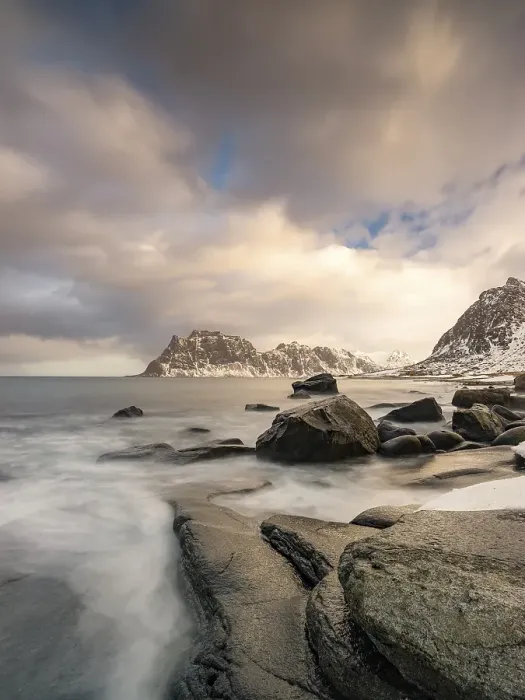 Framed Print : Rounded rocks on Utakleiv beach in a dramatic cloudy atmosphere