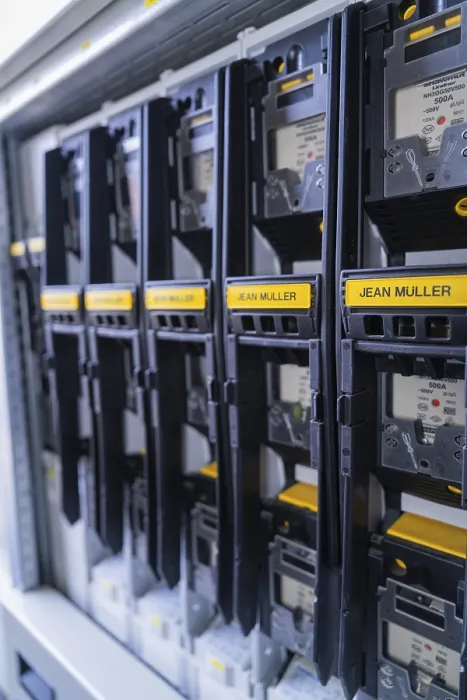 Framed Print : Row of black electricity meters from a specific manufacturer