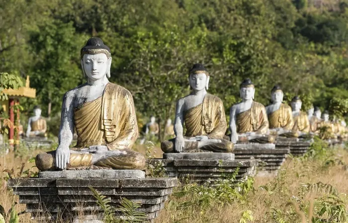 Framed Print : Row of Buddha statues in Lumbini Garden under Mt Zwegabin