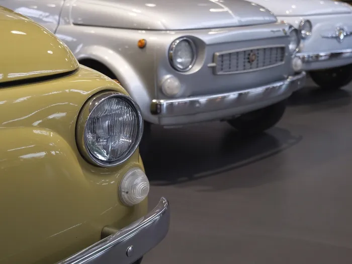 Framed Print : Row of classic cars with yellow and silver vehicle in the foreground