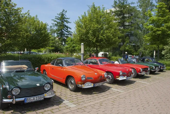 Framed Print : A row of various vintage cars, green and red