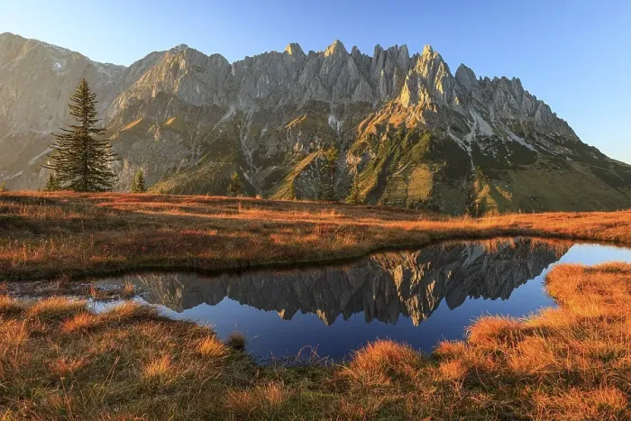 Framed Print : Rugged mountains reflected in a small mountain lake