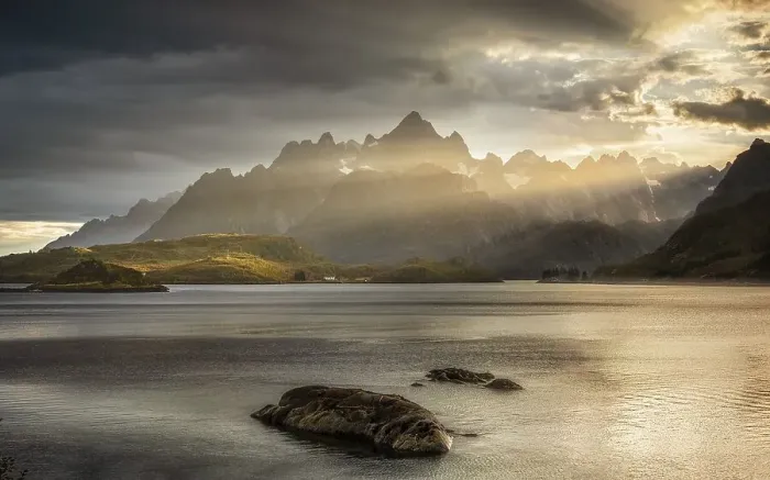 Framed Print : Rugged peaks of the mountain range Trolltindan in the rays of the evening sun