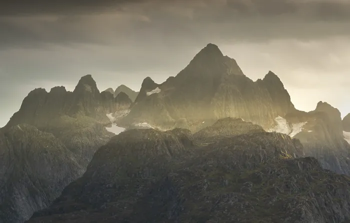 Framed Print : Rugged peaks of the mountain range Trolltindan in the rays of the evening sun