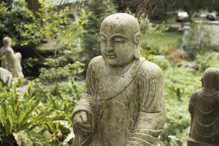 Framed Print : Ruined stone statue Ksitigarbha Bodhisattva in garden