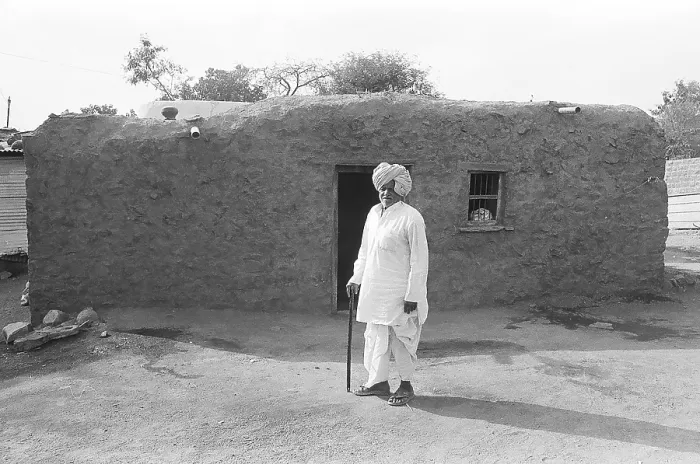 Framed Print : Rural man standing outside of his house Framed Print : Rural man standing outside of his house